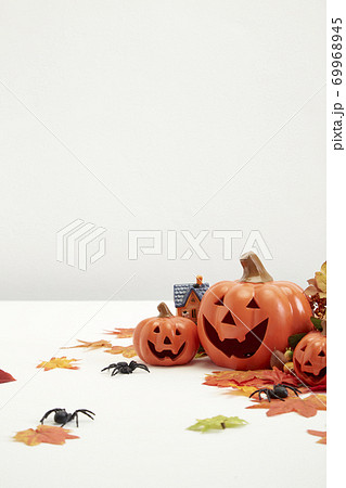 Halloween decorate pumpkins with autumn leaves 69968945