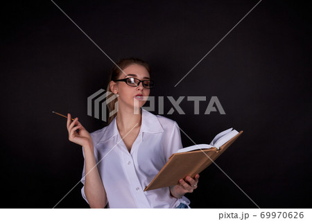 High school girl is reading a book. 69970626