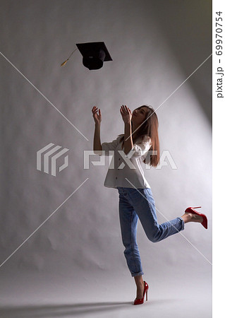 Shape of graduate girl in dark. Shape of graduate girl in dark. 69970754