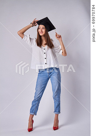 Portrait of beautiful graduate girl. Portrait of beautiful graduate girl. 69970784