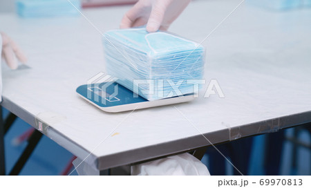 Face mask production line in modern factory Face mask production line in modern factory 69970813