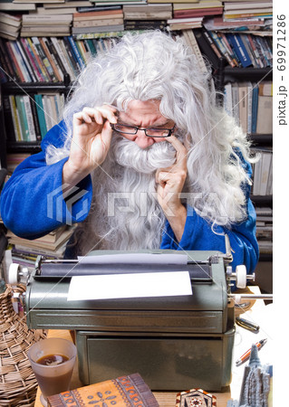 Author working on a old typewriter Author working on a old typewriter 69971286