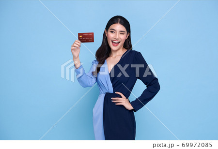 Happy Asian shopaholic women showing credit card 69972085