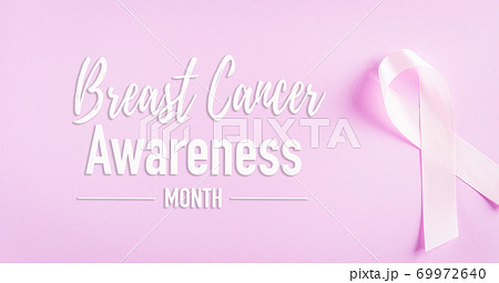 Pink ribbons sign for breast cancer awareness. Symbolic bow color raising awareness on women's breast tumor. Healthcare, medicine and breast cancer awareness concept. Pink ribbons sign for breast cancer awareness. Symbolic bow color raising awareness on women's breast tumor. Healthcare, medicine and breast cancer awareness concept. 69972640