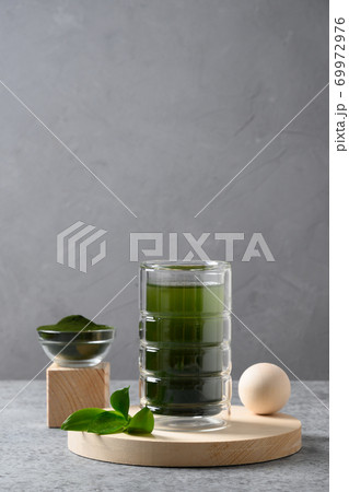 Chlorella healthy drink in glass . Chlorella healthy drink in glass . 69972976
