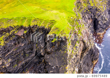 Aerial view of wild coast by Glencolumbkille in County Donegal, Irleand. Aerial view of wild coast by Glencolumbkille in County Donegal, Irleand. 69975489