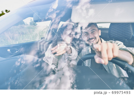 Beautiful couple searching for parking place 69975493