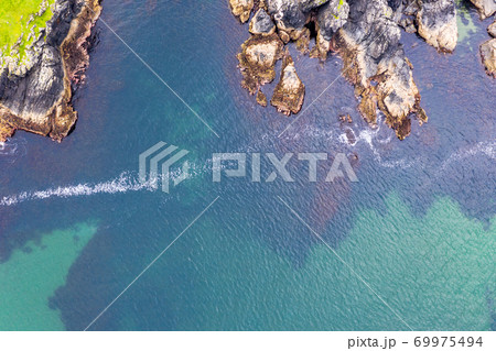 Aerial view of wild coast by Glencolumbkille in County Donegal, Irleand. Aerial view of wild coast by Glencolumbkille in County Donegal, Irleand. 69975494