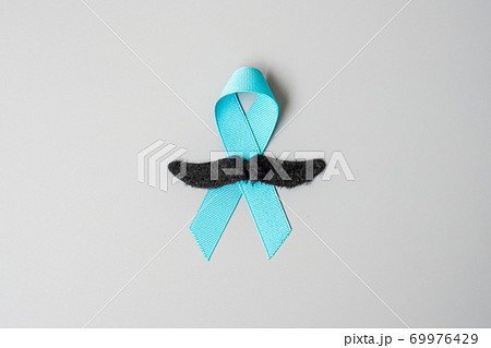 November Prostate Cancer Awareness month, light Blue Ribbon with mustache for supporting people living and illness. Healthcare, International men, Father and World cancer day concept 69976429