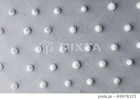 meringue cake pattern on gray background top view 69976525