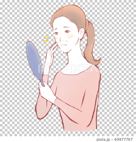 鏡を見ながらほうれい線に手をあてて気にする女性 69977767