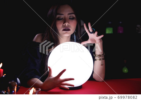 Fortune teller forecast future event or destiny by using crystal ball. Fortune teller forecast future event or destiny by using crystal ball. 69978082