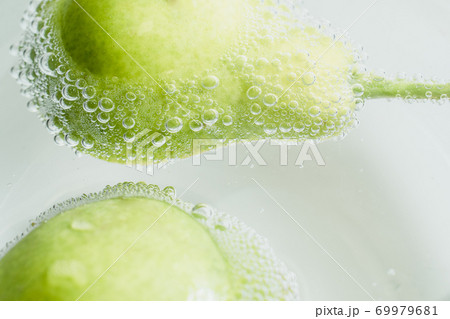 Fresh fruits in water wiht air bubbles. 69979681