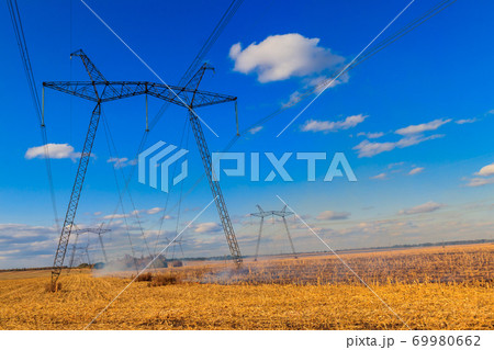 High voltage power line against blue sky High voltage power line against blue sky 69980662