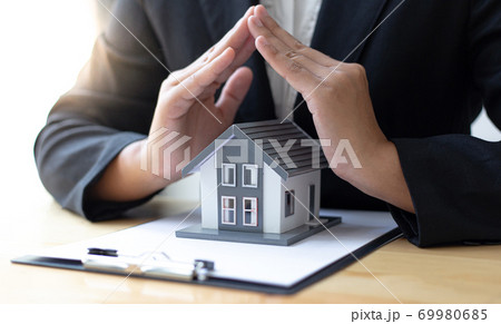 Home sales agents and home insurance are protecting and protecting residents with a strict policy ensuring customers with excellent service,Property insurance and security concept. 69980685