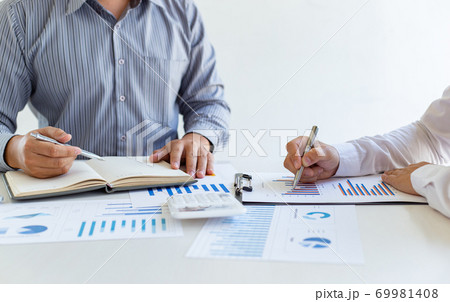 Business team meeting analyze financial graphs market growth reports And corporate income tax, Analysis of financial accounting and real estate investment concept. Business team meeting analyze financial graphs market growth reports And corporate income tax, Analysis of financial accounting and real estate investment concept. 69981408