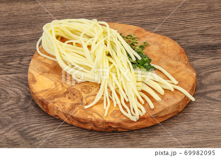 Chechil spaghetti cheese over board 69982095