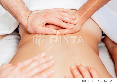 Young man receiving back massage. Young man receiving back massage. 69982321