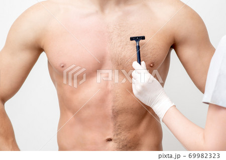 Beautician shaves chest of young man Beautician shaves chest of young man 69982323
