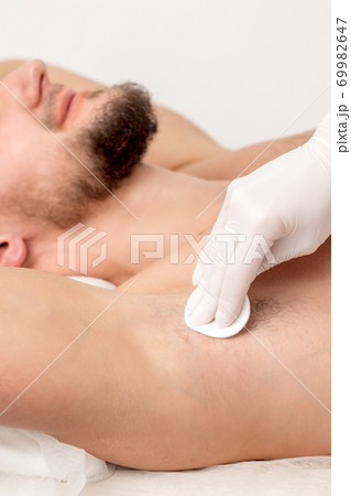 Depilation master wiping male armpit Depilation master wiping male armpit 69982647