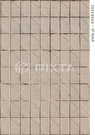 Old Soviet beige wall tiles. The texture of the classical outer tile, which was revetted by buildings during the times of the Soviet Union Old Soviet beige wall tiles. The texture of the classical outer tile, which was revetted by buildings during the times of the Soviet Union 69984392