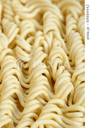 Close up view of yellow dry instant noodles. Chinese traditional food 69984442
