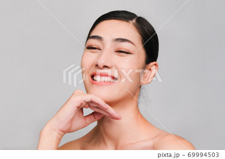 Face of Young beautiful asian woman with clean, fresh and bright skin, Happiness and cheerful with positive emotional,isolated on gray background,Beauty Cosmetics and Facial treatment Concept Face of Young beautiful asian woman with clean, fresh and bright skin, Happiness and cheerful with positive emotional,isolated on gray background,Beauty Cosmetics and Facial treatment Concept 69994503