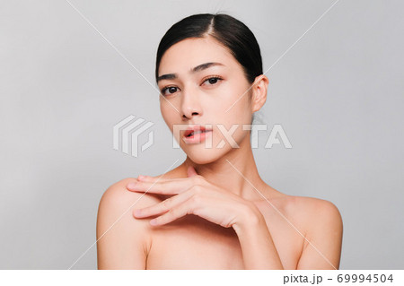 Face of Young beautiful asian woman with clean, fresh and bright skin, Happiness and cheerful with positive emotional,isolated on gray background,Beauty Cosmetics and Facial treatment Concept Face of Young beautiful asian woman with clean, fresh and bright skin, Happiness and cheerful with positive emotional,isolated on gray background,Beauty Cosmetics and Facial treatment Concept 69994504