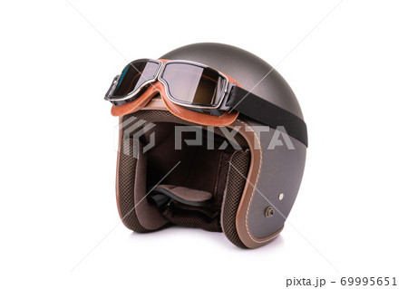 Close up new grey vintage helmet and wind goggle. Studio shot isolated on white Close up new grey vintage helmet and wind goggle. Studio shot isolated on white 69995651