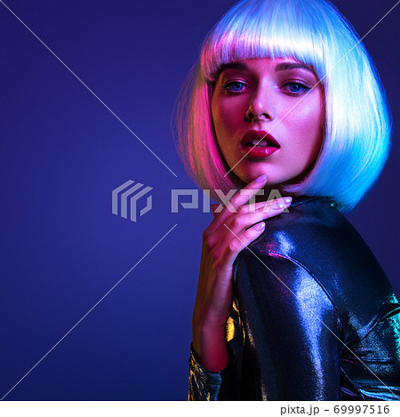 Glamour fashion girl. Beauty face with bright makeup. Young beautiful woman in a white wig, bob hairstyle. Close up art portrait  of  an young attractive woman with vivid colors. Stylish blonde. 69997516