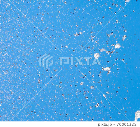 Splashes of water against the blue sky Splashes of water against the blue sky 70001325