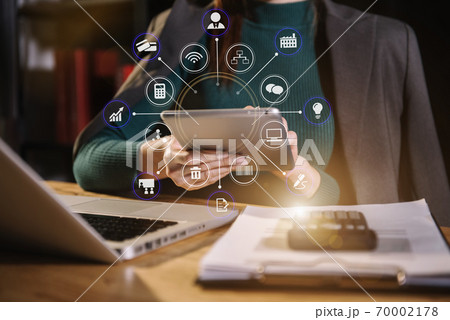 Business women or accountant working on laptop computer with business document, graph diagram and calculator on office table in office. Business women or accountant working on laptop computer with business document, graph diagram and calculator on office table in office. 70002178