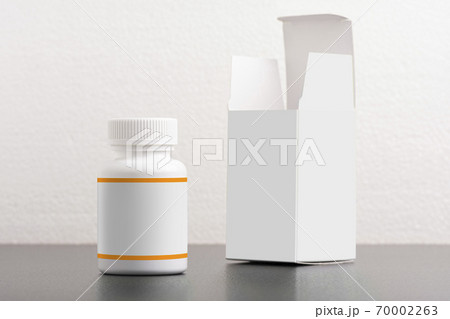 Pillbox dietary supplement bottle with package on background moc 70002263