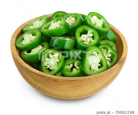 sliced jalapeno pepper in wooden bowl isolated on white background. Green chili pepper with clipping path and full depth of field. 70002288