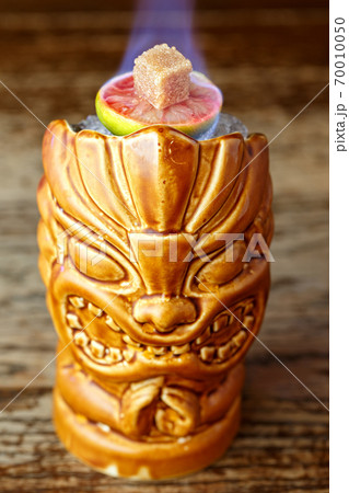 cocktail with fire in a glass of tiki cocktail with fire in a glass of tiki 70010050