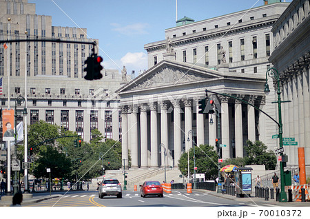 Facade of New York State Supreme Court Building with people around in Manhattan Facade of New York State Supreme Court Building with people around in Manhattan 70010372