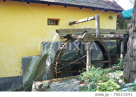 Old wooden wheel from a mill on the river 70011041