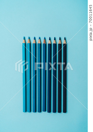 book, pencil, ruler on a blue background. 70011645