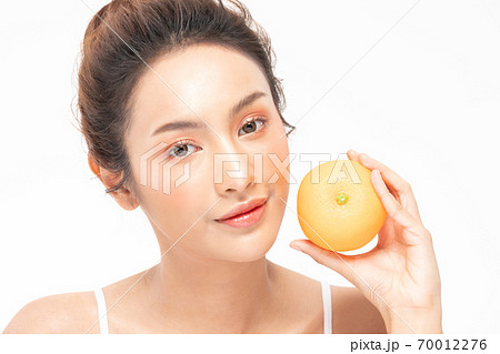 Beautiful Young Asian Woman Holding orange vitamin c smile feeling so happy and cheerful with healthy Clean and Fresh skin,isolated on white background,Beauty Cosmetics spa and treatment Concept 70012276