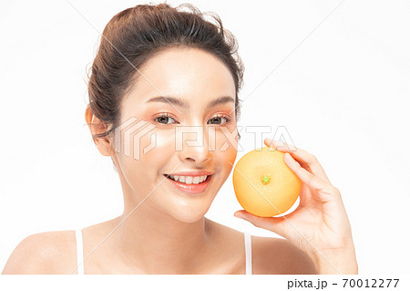 Beautiful Young Asian Woman Holding orange vitamin c smile feeling so happy and cheerful with healthy Clean and Fresh skin,isolated on white background,Beauty Cosmetics spa and treatment Concept 70012277