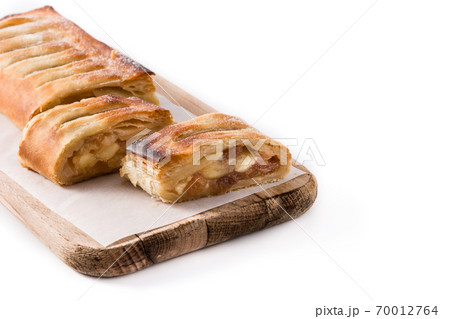 Traditional homemade apple strudel isolated on white background. Copy space Traditional homemade apple strudel isolated on white background. Copy space 70012764