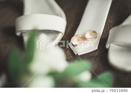 Two golden wedding rings isolated background concept 70013890