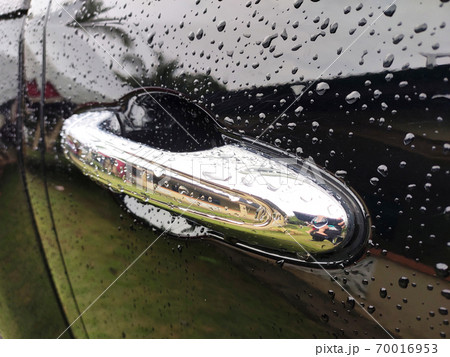 Selected focusing on raindrops and dew on black metal surfaces. These little drops will disappear when exposed to sunlight. 70016953