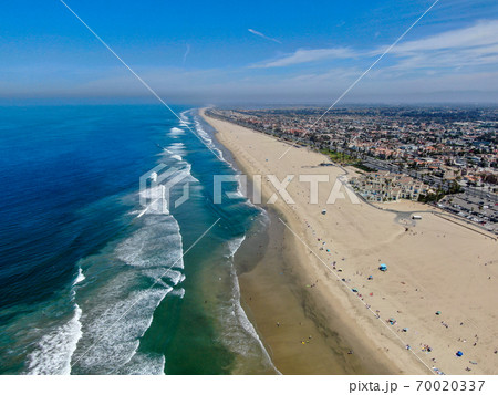 Aerial view of Huntington Beach and coastline during hot blue sunny summer day 70020337