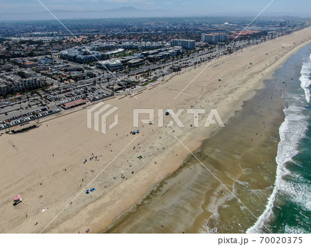 Aerial view of Huntington Beach and coastline during hot blue sunny summer day 70020375