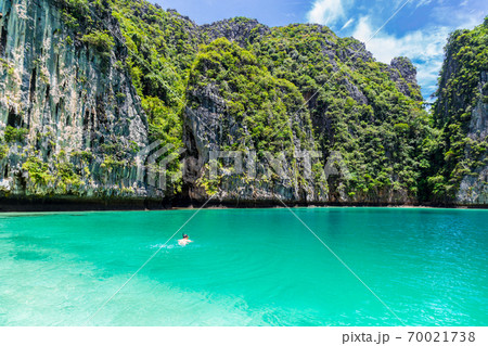Young man snorkel diving at Phi Phi island, Thailand. Young man snorkel diving at Phi Phi island, Thailand. 70021738