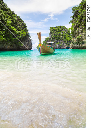 Thai traditional wooden longtail boat and beautiful beach in Thailand. Thai traditional wooden longtail boat and beautiful beach in Thailand. 70021740