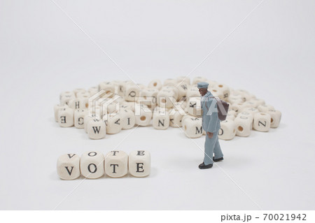 a word vote on wooden cube block with figure a word vote on wooden cube block with figure 70021942