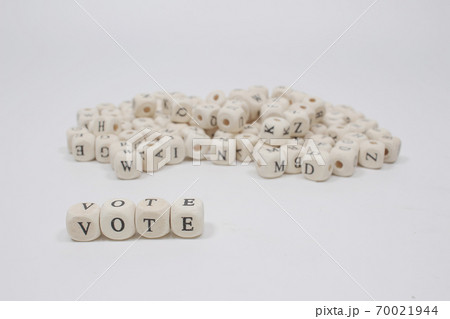 a word vote on wooden cube block white background a word vote on wooden cube block white background 70021944
