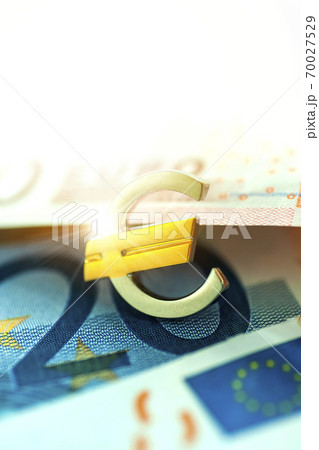 Euro symbol and euro bills Euro symbol and euro bills 70027529
